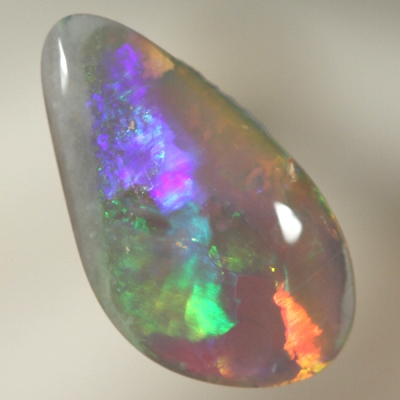 SOLID SEMI BLACK OPAL Large rolling flashes of bright multicolours